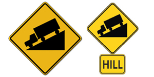 警告驾驶员前方有山丘或陡坡，减速并准备换低档以控制速度并节省刹车片磨损