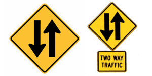 双向交通标志。 双向交通标志的目的是提醒在单向街道或高速公路上行驶的驾驶员,前方的车道将变成双向交通